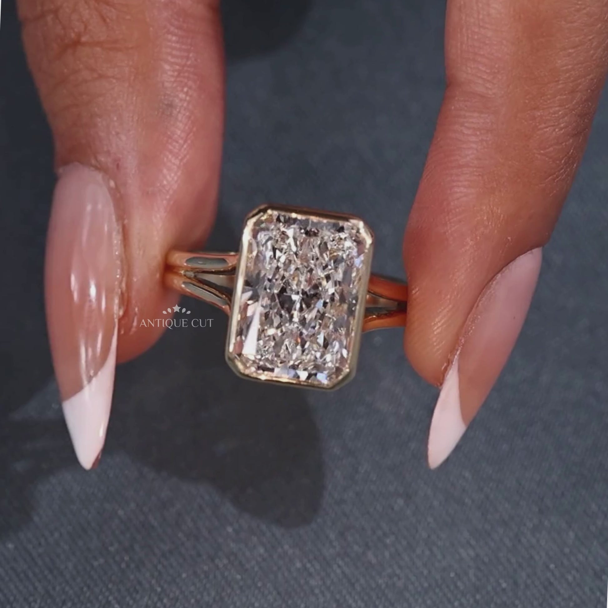 Radiant cut diamond ring with split shank band