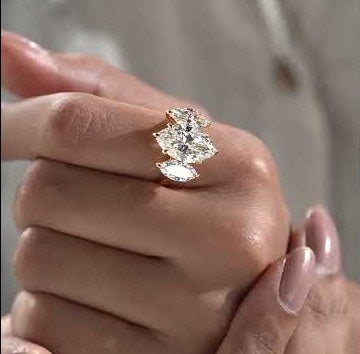  Marquise diamond three stone engagement ring with yellow gold setting