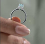 Fancy blue emerald cut diamond engagement ring with pavé band