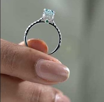 Fancy blue emerald cut diamond engagement ring with pavé band