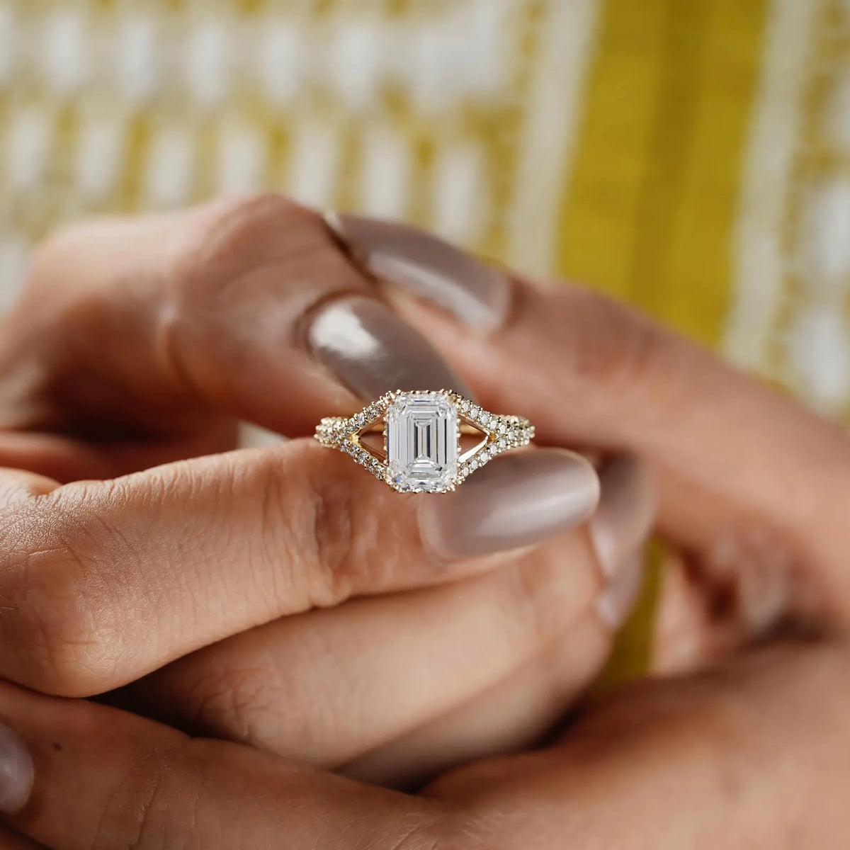 White gold emerald cut split shank diamond ring