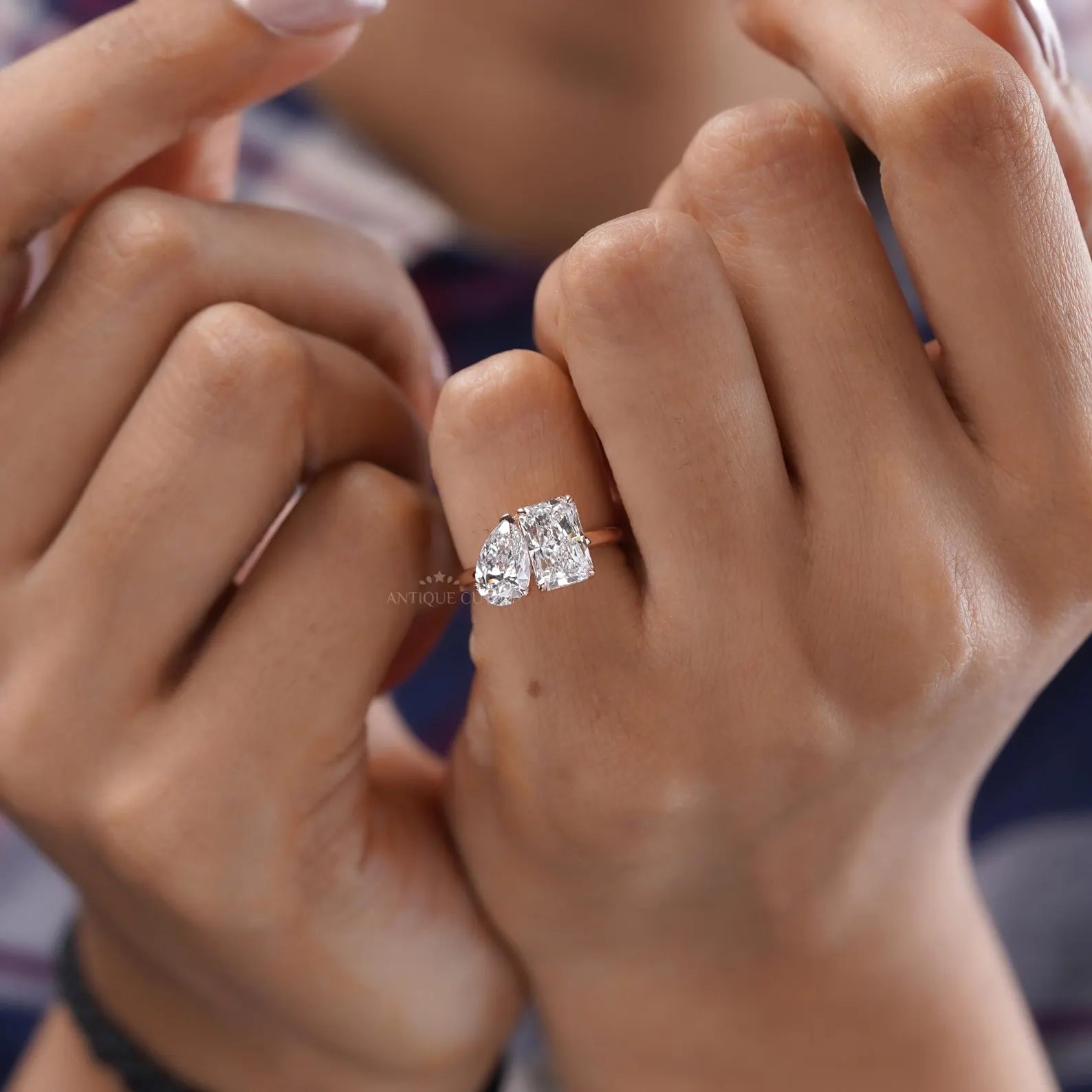 Two diamond toi et moi ring with pear cut and elongated radiant stones