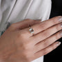 Emerald cut east west diamond engagement ring