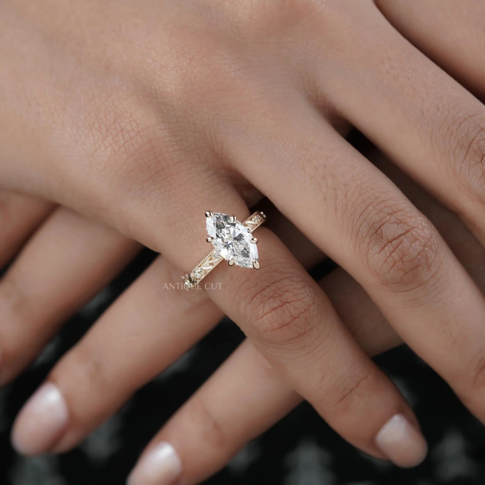 Hand engraved marquise engagement ring in yellow gold