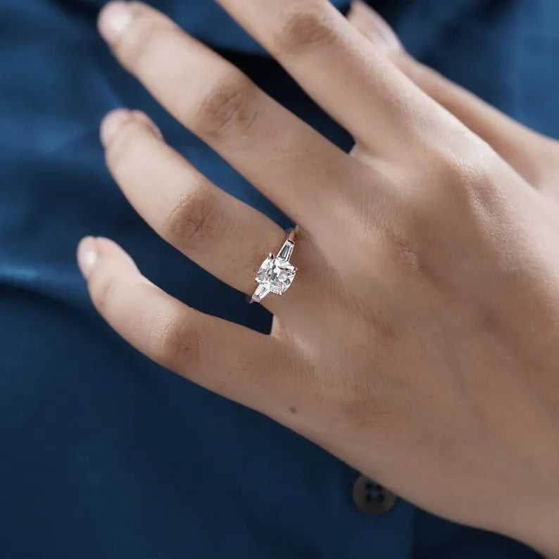 Three stone old mine cushion cut diamond ring