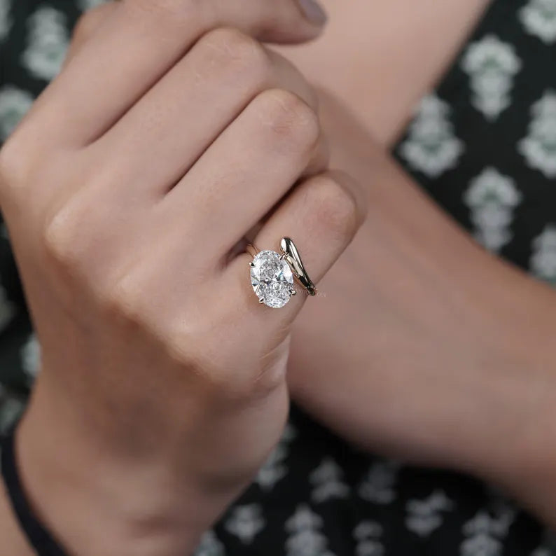 oval-cut diamond bypass engagement ring