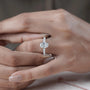 Oval diamond engagement ring with pave band
