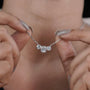 Cushion cut diamond necklace with pear shaped side stones