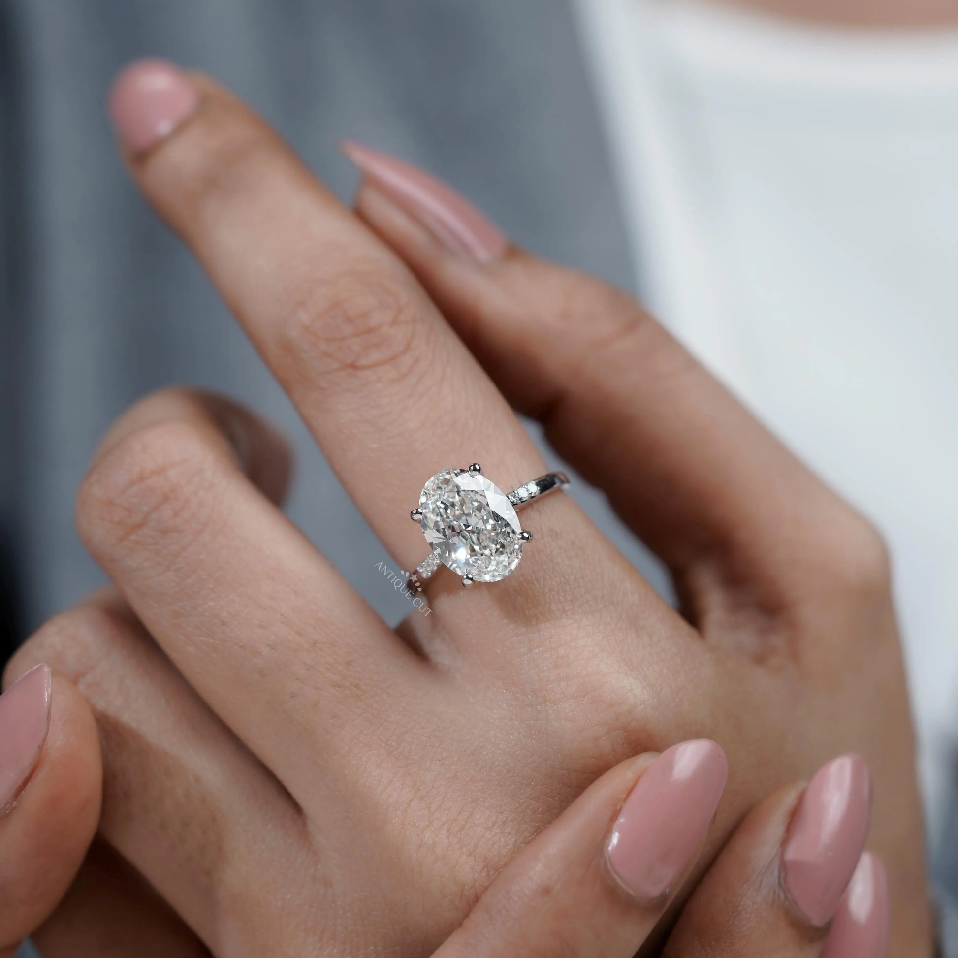 Oval Cut Diamond Engagement Ring with Diamond Accents