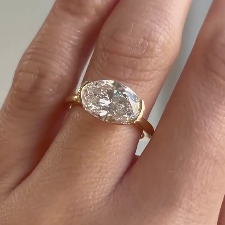 Yellow gold oval engagement ring horizontal design