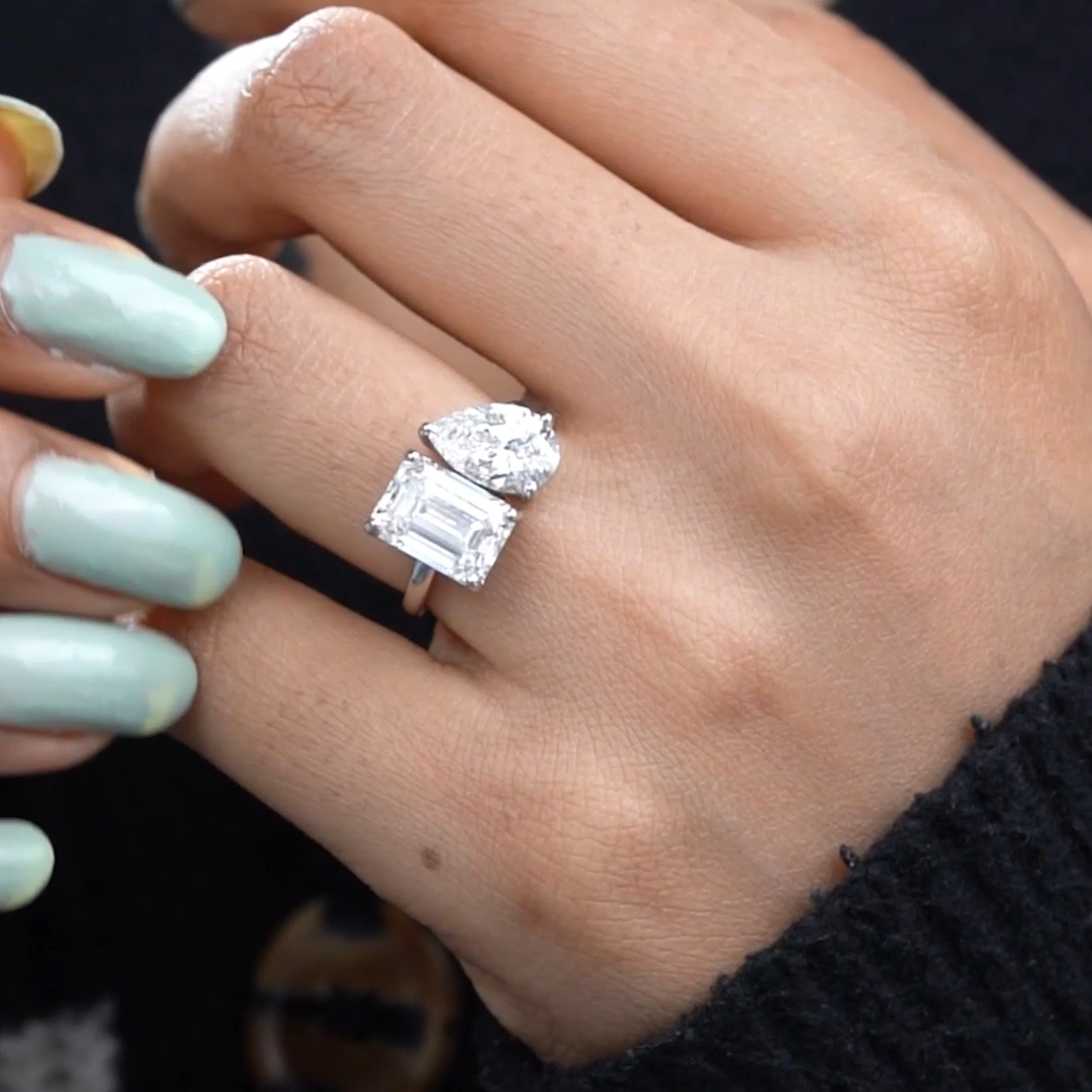 Emerald and pear diamond ring in white gold
