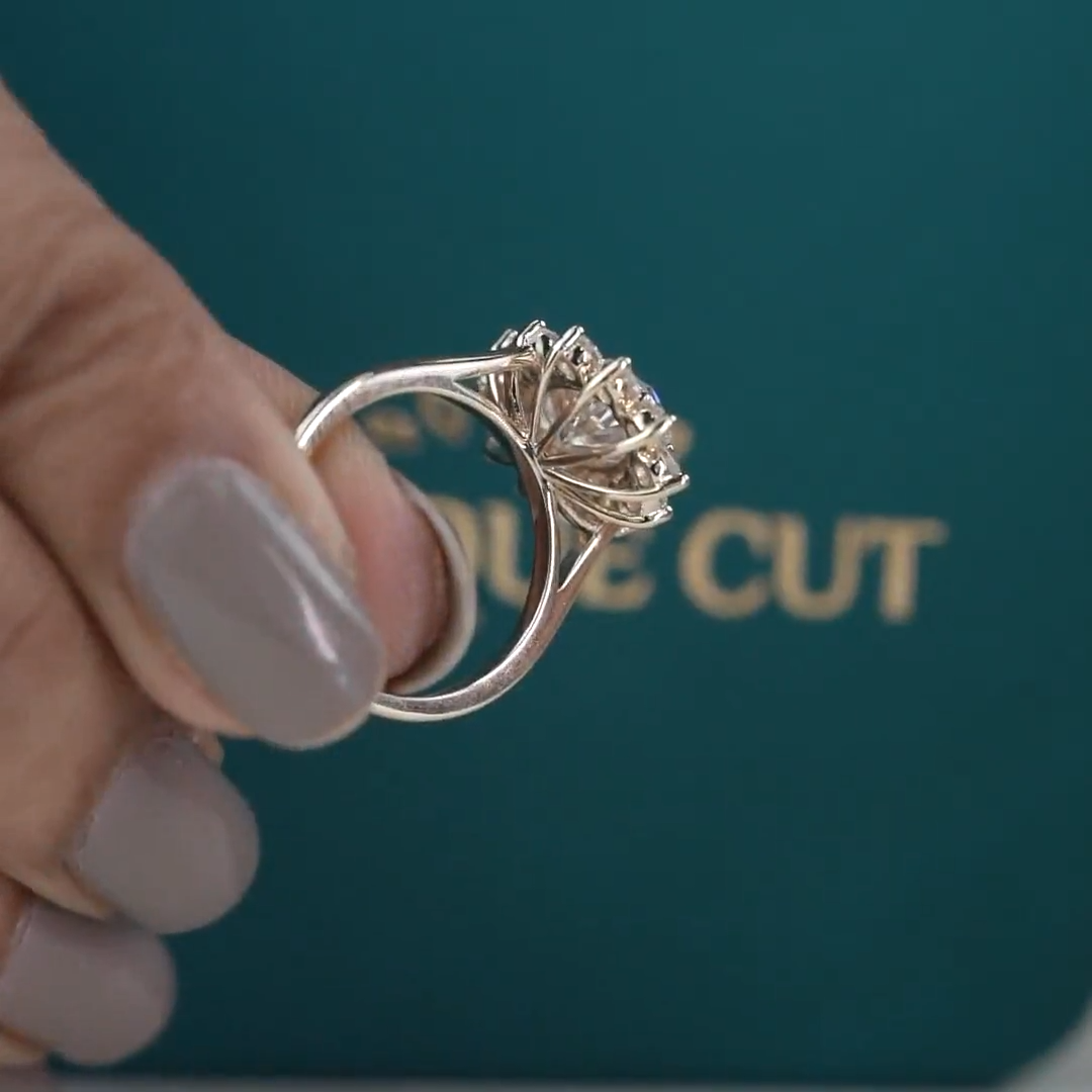 Vintage floral oval diamond engagement ring