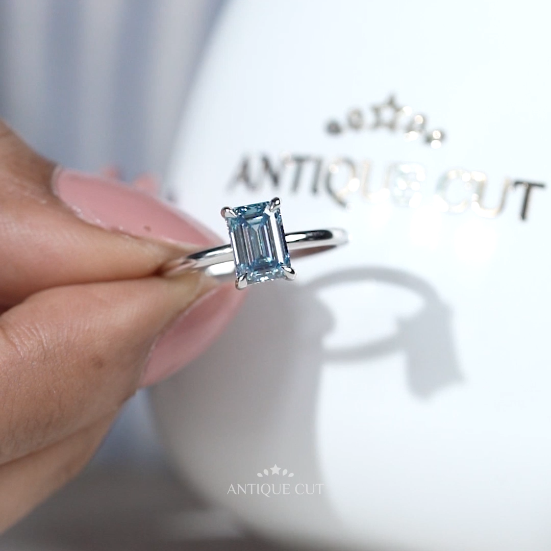 White gold blue diamond engagement ring solitaire