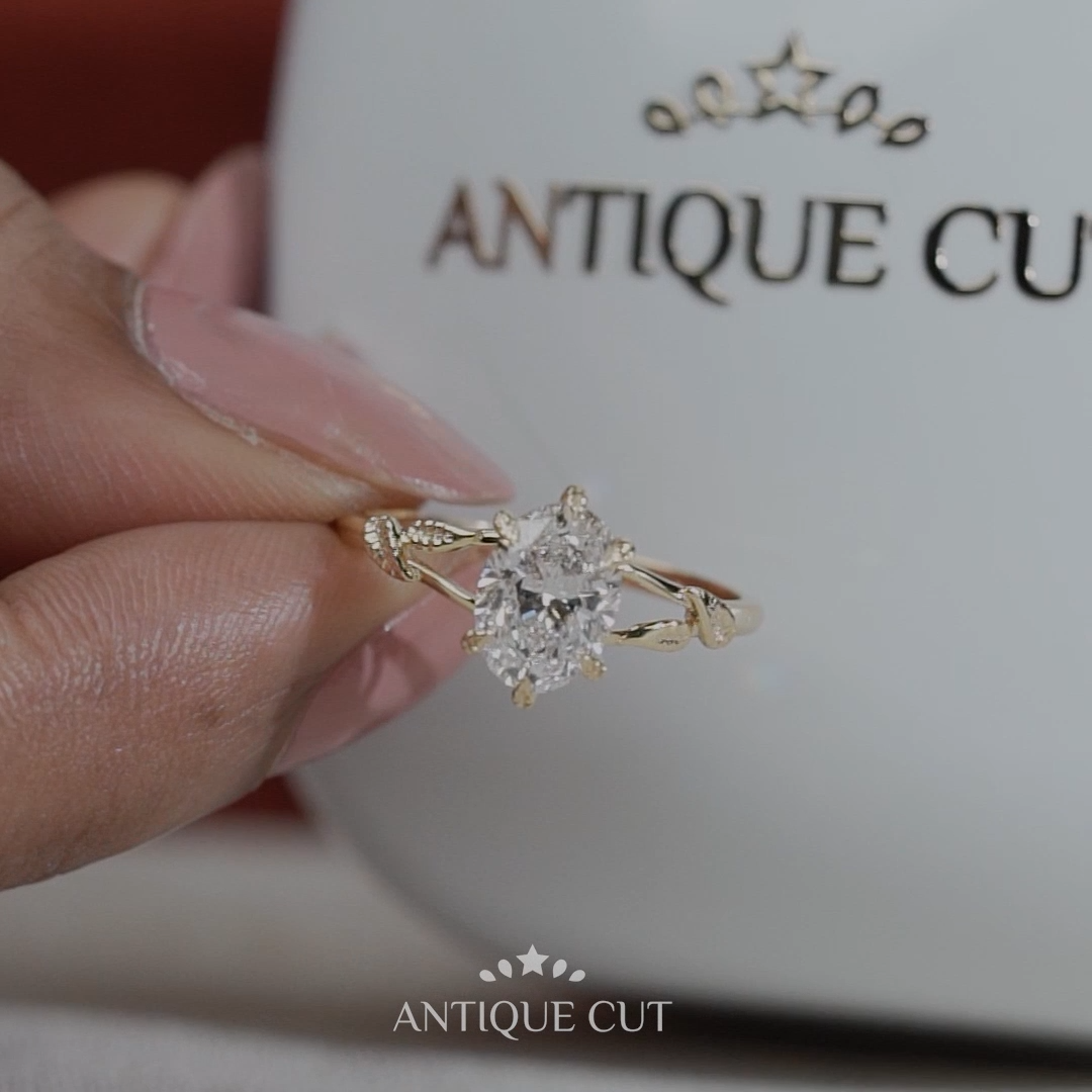 Floral leaf design oval diamond solitaire engagement ring