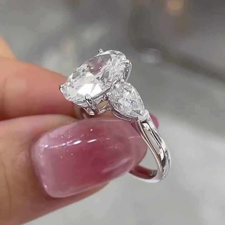 Oval 5.00tcw Lab Grown Diamond 3 Stone Engagement Ring | D-E-F Color VVS-VS Clarity | Pear Side Stones | IGI Certified
