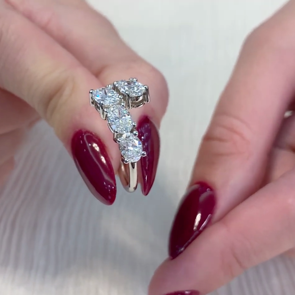 Oval cut engagement ring with rounded prong setting.