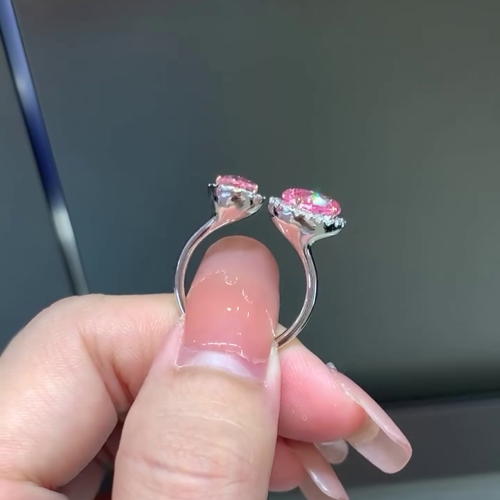 Pink lab grown diamond earrings with pear and oval center stones