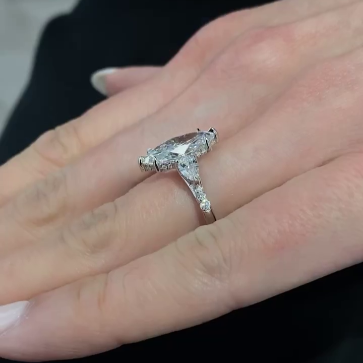 White gold marquise engagement ring three stone design