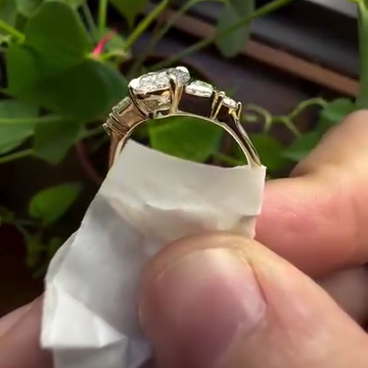 Yellow gold oval five stone lab grown diamond engagement ring.