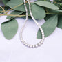Diamond necklace with eucalyptus leaves.