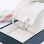 Diamond hoop earrings in a jewelry box.